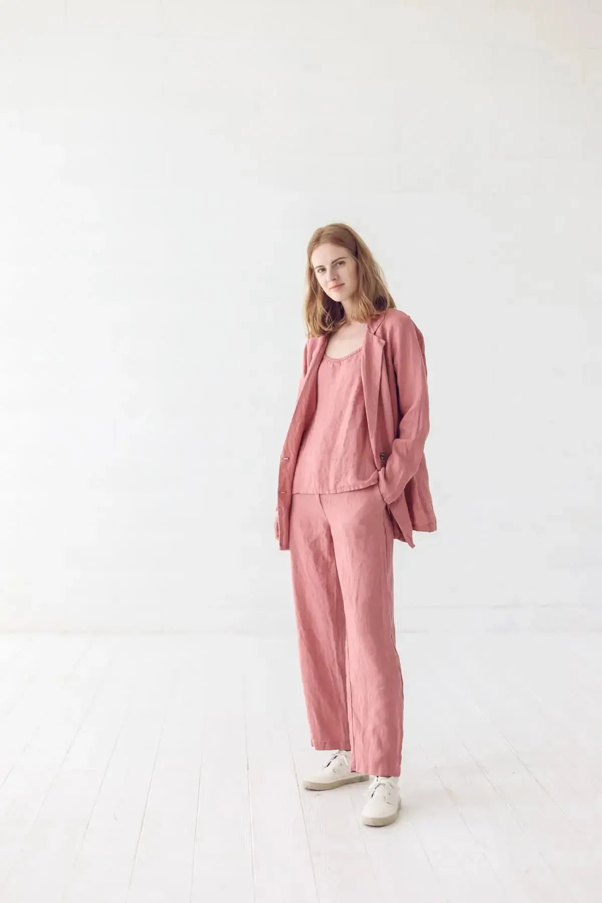 Model in a linen jacket with a hand in pocket, casual look