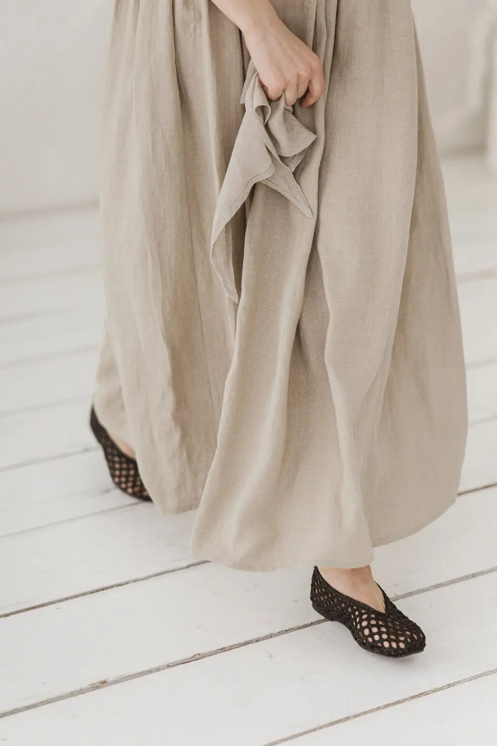 Front view of linen maxi dress, flowing silhouette from waist down