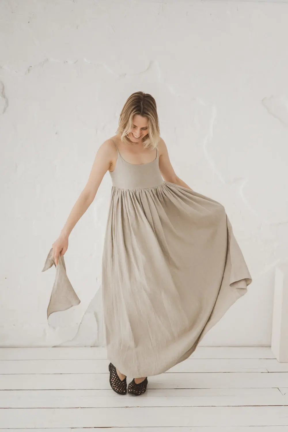 Full length front view of linen maxi dress with flowing gathered waist