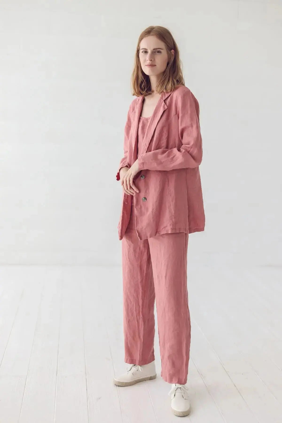Full-length view of a woman in a classic linen jacket